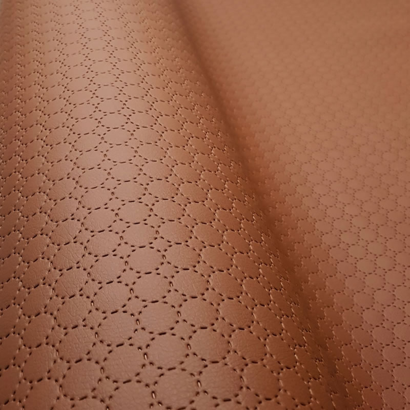 KK401 Exkluzívní koženka zbytek 45x140cm koženka kolečka (průměr 1,3cm) hnědá na vatelínu