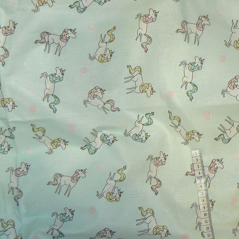 6R216 Bavlněná látka plátno 100x70cm jednorožci na mint zbytek na patchwork