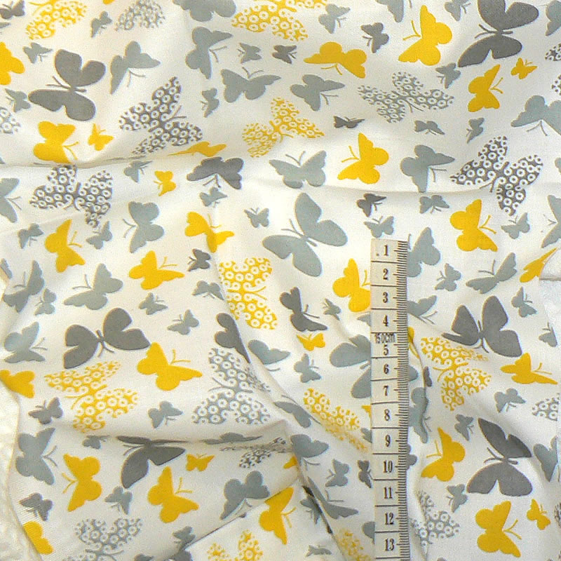 7F59 Bavlněná látka plátno 76x41cm šedožlutá motýlci zbytek na patchwork