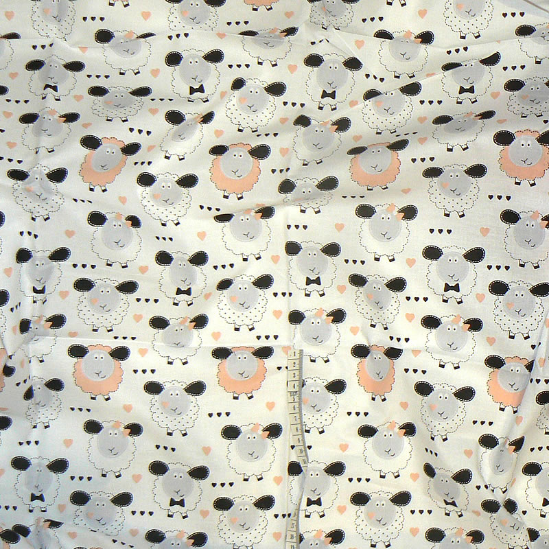 7H92 Bavlněná látka 170x65cm ovečky oranžovobílá zbytek na patchwork