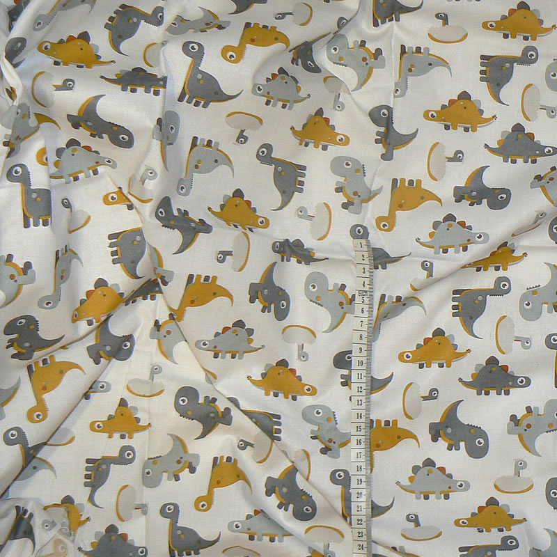 7M73 Bavlněná látka 75x32cm dinosauříci na bílé zbytek na patchwork